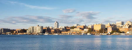 Victoria, Vancouver Island, British Columbia, Canada - August 18, 2021: Modern City Skyline in Downtown Victoria Harbour during sunny summer sunset.のeditorial素材
