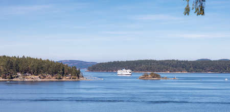 Victoria, Vancouver Island, British Columbia, Canada - August 10, 2021: BC Ferries Boat Leaving to the Terminal in Swartz Bay during sunny summer morning.のeditorial素材