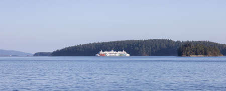 Salt Spring Island, British Columbia, Canada - August 23, 2021: BC Ferries passing by Gulf Islands during a sunny summer day.のeditorial素材