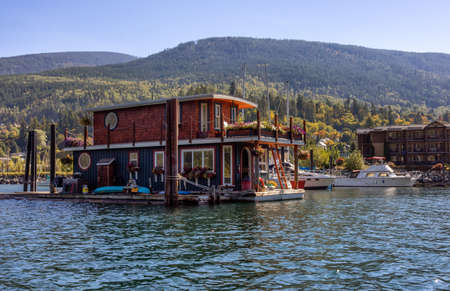 Nelson, British Columbia, Canada - September 25, 2021: Houseboat in a marina during a sunny morning.のeditorial素材