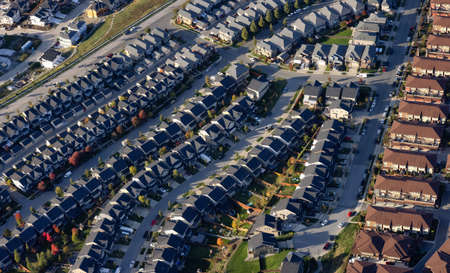 Residential Homes in Maple Ridge City in Greater Vancouver, British Columbia, Canada. Aerial View from Airplane. Sunny Fall Season.の写真素材