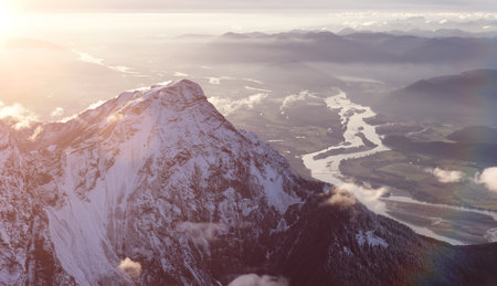 Aerial View of Canadian Rocky Mountains with snow on top during Fall Season Sunset. Nature Landscape located near Chilliwack, East of Vancouver, British Columbia, Canada.の写真素材