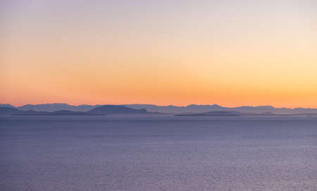 Aerial View of Pacific Ocean West Coast. Vancouver Island landscape in background. Sunny Sunset Sky....