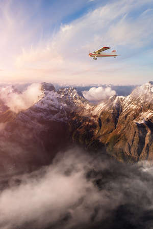 Single Engine Airplane Flying over the Rocky Mountain Landscape. Adventure Composite. 3D Rendering...