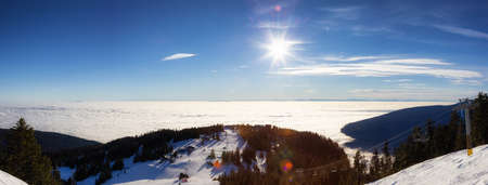 Panoramic View of Top of Grouse Mountain Ski Resort with the City in the background. North Vancouver, British Columbia, Canada.の写真素材