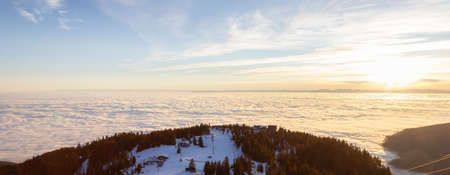 Panoramic View of Top of Grouse Mountain Ski Resort with the City in the background. North Vancouver, British Columbia, Canada. Sunset Skyの写真素材