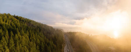 Aerial panoramic view of Sea to Sky Highway in Horseshoe Bay during a sunny winter sunset. Taken in West Vancouver, British Columbia, Canada.の写真素材