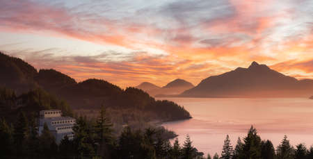 Panoramic View of Britannia Beach during winter season. Dramatic Sunset Sky Art Render Located in Howe Sound between Squamish and Vancouver, British Columbia, Canada.の写真素材