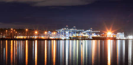 New Westminster, Vancouver, British Columbia, Canada - March 3, 2022: Industrial Port with Ships on Fraser River at night.のeditorial素材