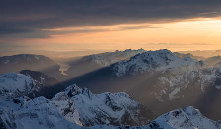 Aerial Panoramic View of Canadian Rocky Mountain Landscape. Cloudy Sunset Sky. Located near...