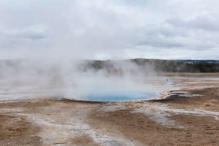 Hot spring Geyser with colorful water in American Landscape. Celestine Pool in Yellowstone National Park, Wyoming, United States. Nature Background.の写真素材