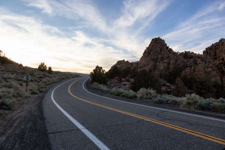Scenic highway in the mountain landscape. Sunset Sky. State Route 120, California, United States of...