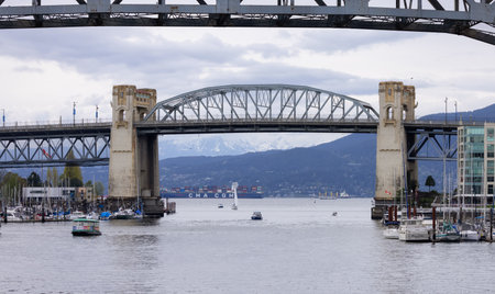 Vancouver, British Columbia, Canada - May 7, 2022: Burrard Bridge in False Creek, Downtown City on the West Coast of Pacific Ocean.のeditorial素材