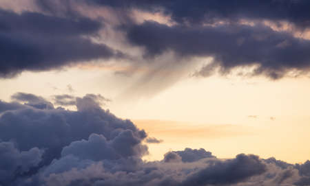 View of Cloudscape during a colorful sunset or sunrise. Taken on the West Coast of British Columbia,...