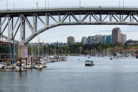 Vancouver, British Columbia, Canada - May 7, 2022: View of Granville Island, Downtown City and marina in modern cityscape on the West Coast of Pacific Ocean.のeditorial素材