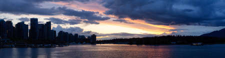 Panoramic View of Coal Harbour, Marina, Modern City and Stanley Park. Dramatic Sunset Sky. Downtown...
