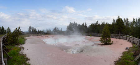 Hot spring Geyser with colorful water in American Landscape. Cloudy Sky Art Render. Yellowstone...
