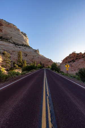 Scenic Road in American Mountain Landscape. Sunny Morning Sunrise Sky. Zion National Park, Utah, United States of America. Adventure Travelの写真素材