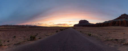 Scenic Road in Red Rock Mountains in the Desert at Colorful Sunrise. Spring Season. Goblin Valley...