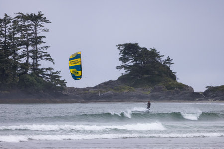 Tofino, Vancouver Island, British Columbia, Canada - July 11, 2022: Man Kitesurfing in the Pacific...