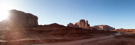 Desert Rocky Mountain American Landscape. Sunny Morning Sunrise. Oljato-Monument Valley, Utah, United States. Nature Background Panoramic Viewの写真素材