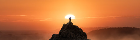 Adventurous Man Hiking on the Rocky Coast with Mountains and Dramatic Sunset Sky. Adventure Composite. 3d Rendering Rocks. Background from West Coast of British Columbia, Canada.の写真素材