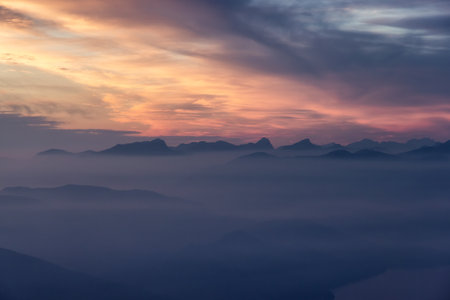Canadian Mountain Landscape on the West Coast of Pacific Ocean. Dramatic Sunset and Hazy Smoky Sky. St. Marks Summit near Vancouver, British Columbia, Canada. Nature Backgroundの写真素材