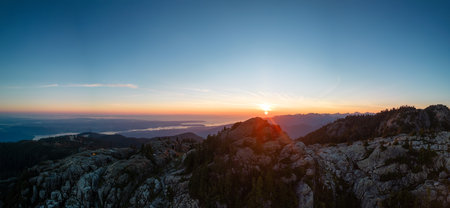 Rocky top of Canadian Mountain Landscape. Sunny Sunset Sky. Top of Mt Seymour near Vancouver, British Columbia, Canada. Nature Background Panoramaの写真素材