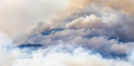 BC Forest Fire and Smoke over the mountain near Hope during a hot sunny summer day. British Columbia, Canada. Wildfire natural disasterの写真素材