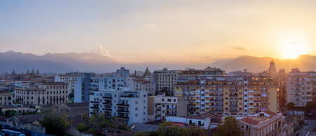 Residential Homes and Historic Buildings with mountains in background in Palermo, Sicily, Italy. Sunset Colorful Sky. Panoramaの写真素材