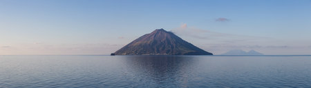Stromboli Island with an Active Volcano in Tyrrhenian Sea. Italy. Sunny Morning Sunrise Sky. Nature Background Panoramaの写真素材