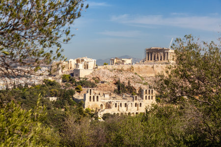 Historic Landmark, Odeon of Herodes Atticus, in the Acropolis of Athens, Greece. Sunny Day viewed from Philopappos Hill.の写真素材
