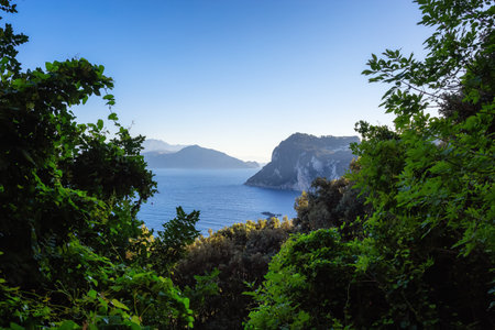 Capri Island in Bay of Naples, Italy. Sunny Blue Sky. Nature Background.