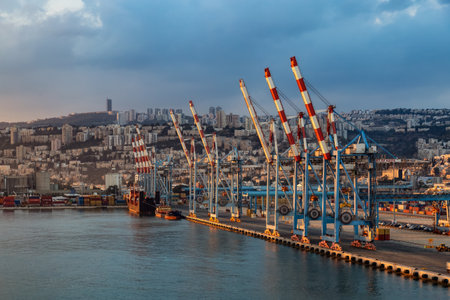 Haifa, Israel - November 6, 2022: Port of Haifa during dramatic sunrise. View from cruise ship.のeditorial素材