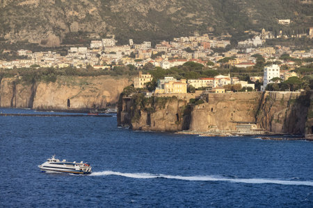 Rocky Coast and Homes in Touristic Town, Sorrento, Italy. Amalfi Coast. Sunny Eveningの写真素材