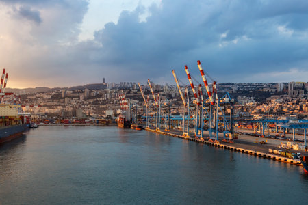 Haifa, Israel - November 6, 2022: Port of Haifa during dramatic sunrise. View from cruise ship.のeditorial素材