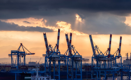 Haifa, Israel - November 6, 2022: Port of Haifa during dramatic sunrise. View from cruise ship.