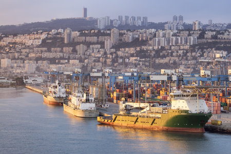 Haifa, Israel - November 6, 2022: Port of Haifa during dramatic sunrise. View from cruise ship.のeditorial素材