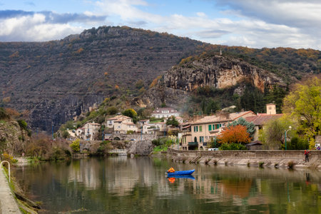 Homes, River and Mountains in Le Pouzin, France, Europe. Cloudy Sky Art Render.の写真素材