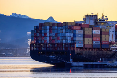 Vancouver, British Columbia, Canada - January 29, 2023: Container Ship in the Port of Vancouver Harbour. Winter Sunrise Skyのeditorial素材