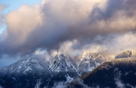 North Shore Mountains Covered in Snow and Clouds. North Vancouver, British Columbia, Canada. Nature...