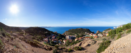 Small Touristic Town, Nebida, on the Sea Coast. Sardinia, Italy. Sunny Day. Panoramaの写真素材