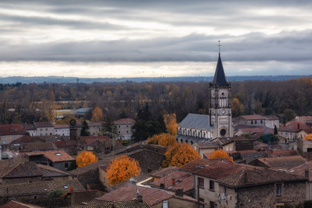 Small old town and Church in Mauves, France. Cloudy Moody Sunset Sky.の写真素材
