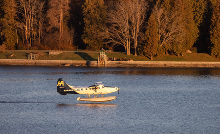 Vancouver, British Columbia, Canada - January 29, 2023: Harbour Air Float Airplane taking off from...
