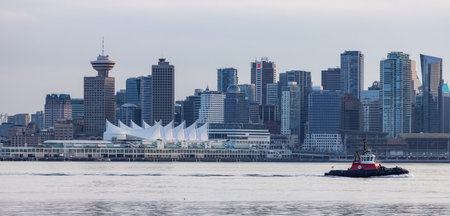 Vancouver, BC, Canada - March 18, 2023: Tug Boat in front of Canada Place and Downtown City.