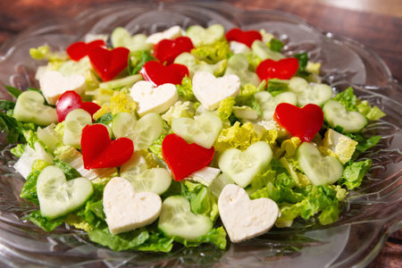 Fresh Salad on a plate with Red, Green and White Heart Shapes. Valentines Day Themeの写真素材