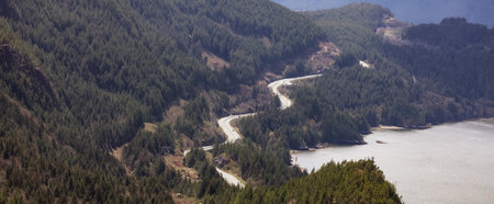 Aerial view of Sea to Sky Highway in Squamish, BC, Canada. Vibrant Sunny Day. Zoomの写真素材
