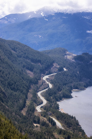 Aerial view of Sea to Sky Highway in Squamish, BC, Canada. Vibrant Sunny Day. Zoomの写真素材