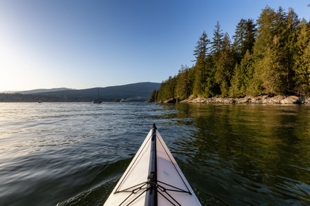 Kayaking in Indian Arm near Belcarra, Vancouver, BC, Canada. Sunny Sunset. Adventure Travel Conceptの写真素材