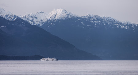 West Vancouver, British Columbia, Canada - April 14, 2023: BC Ferries leaving the Horseshoe Bay Terminal in Howe Sound during colorful Sunset.のeditorial素材